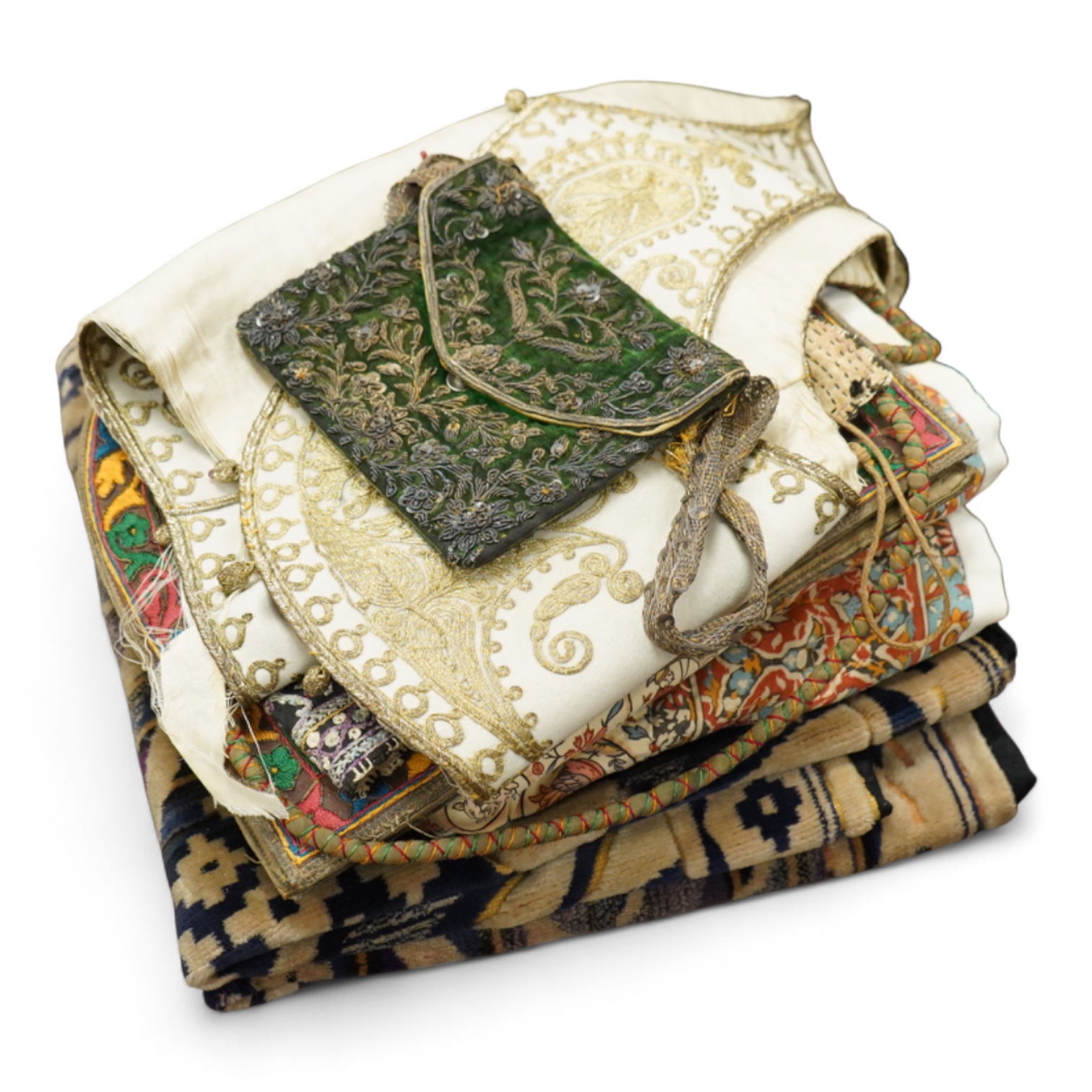 A collection of 20th century textiles to include: child's cream and gold embroidered waistcoat, a metallic embroidered bag, a leather embroidered bag, two Art Deco printed velvet cushion covers, a cotton quilted runner a